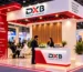 Event branding in Dubai with a branded backdrop and promotional display